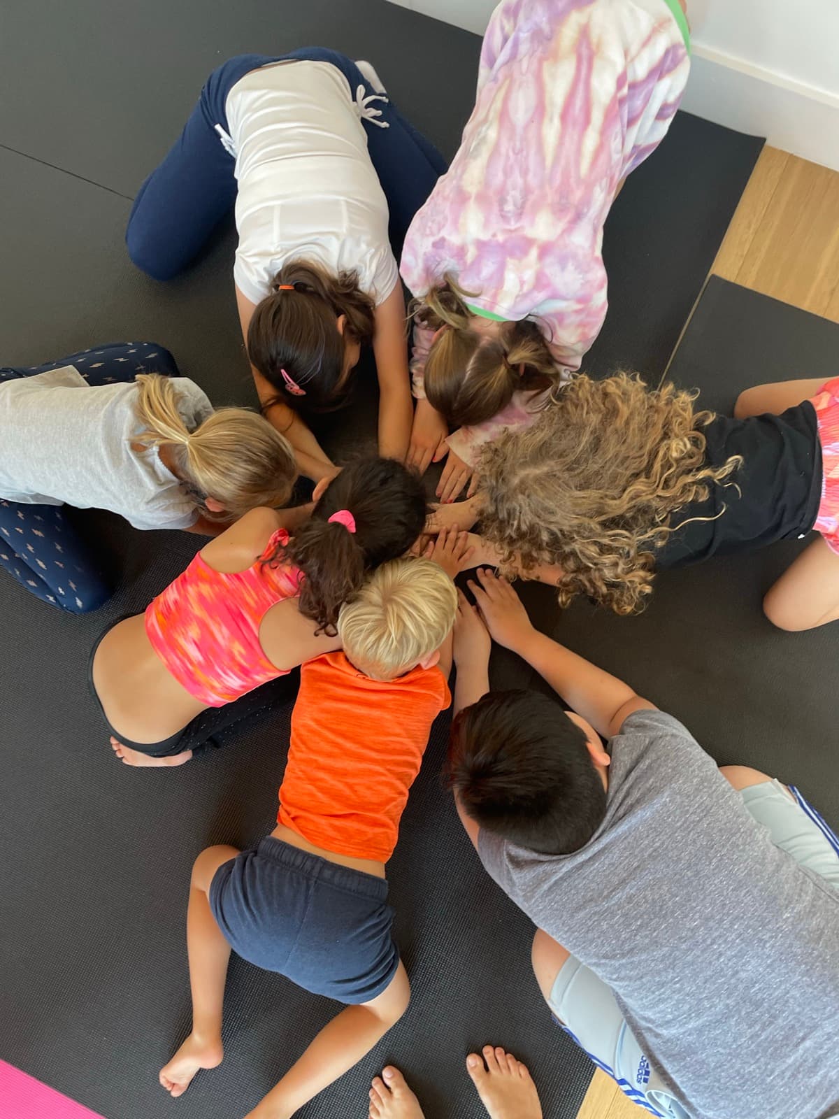 Children gathered together at Houston Kids Yoga camp